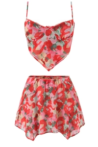 Detail of strawberry print mesh two-piece set featuring camisole top and matching skirt