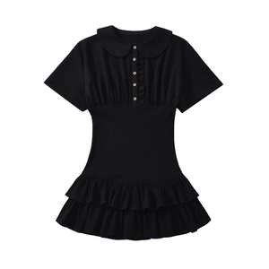Detail of black summer dress with ruffle hem, doll collar and decorative gold buttons