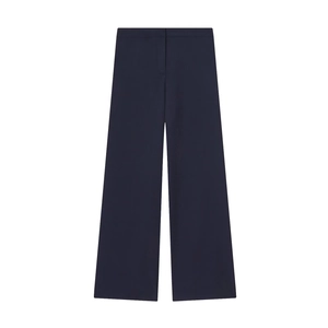 Détail d'un pantalon large bleu marine à taille haute en tissu de costume haut de gamme