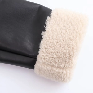 Black leather jacket with thick beige faux shearling lining and wide fuzzy cuffs