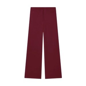 Détail d'un pantalon large bordeaux avec taille haute et fermeture éclair dissimulée