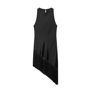 Detail view of smooth satin dress featuring long tassels and asymmetric hemline