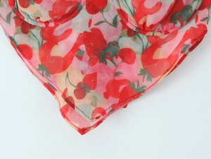 Close-up of strawberry print top with V-shaped hem and built-in cup padding