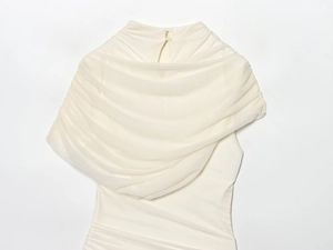 Detail view of the stand collar and sheer mesh patchwork on an ivory slim sleeveless dress