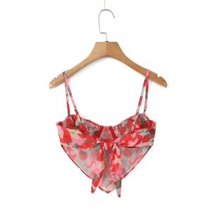 Detail of red strawberry print crop top with tie-back bow and delicate straps