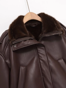 Close-up of brown faux leather bomber jacket with thick faux fur collar and metal zipper