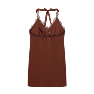 Close-up of brown satin halter dress featuring intricate lace trim and pleated bust detail