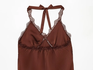 Detailed view of brown satin slip dress with lace trim and elegant halter neck ribbon