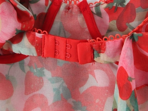 Detailed macro view of back dual metal hook closure on strawberry print camisole set