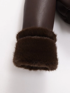 Detail of dark brown leather jacket cuff with plush faux fur trim and textured finish