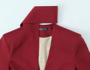 Detail of burgundy blazer showing scarf collar design and inner lining with size S label
