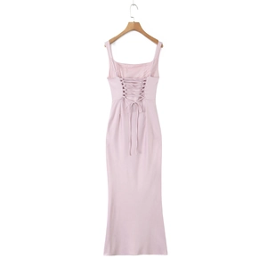 Detail of light pink backless dress with corset style lace-up ties and fishtail design