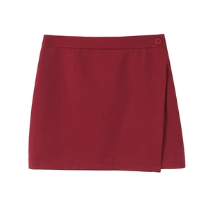 Close-up of a burgundy wrap skirt with a woven texture and matching round side button