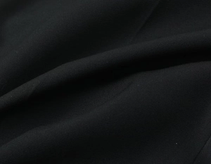 Vue détaillée de la texture du tissu en toile noire épaisse et du motif tissé