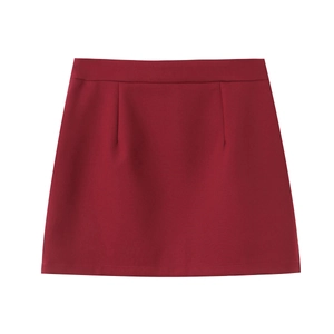 Detail view of burgundy A-line mini skirt with darts and structured twill fabric texture