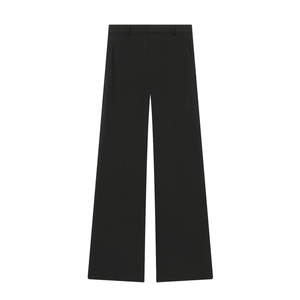 Detailed view of high-waist black wide-leg suit trousers with premium draped fabric texture