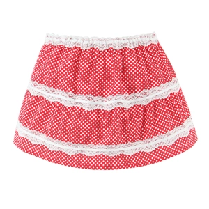 Detail of red polka dot tiered skirt with delicate white lace trim for girls