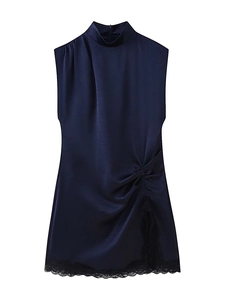 Detail of navy blue satin dress featuring side ruching and black lace patchwork hemline