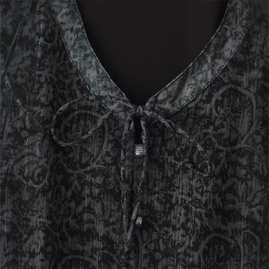 Metallic thread V-neck dress with vintage damask pattern and tie-up neckline