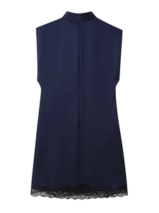 Detail of navy satin sleeveless dress with chic lace hem and high collar design
