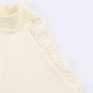 Detail of ribbed knit top with intricate floral lace trim and chic mock neckline