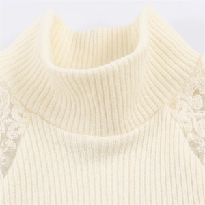 Close-up of ribbed knit mock neck top with floral lace patchwork on shoulders