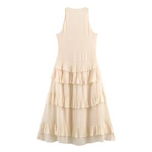 Detail view of tiered chiffon layers on an apricot halter neck dress for women