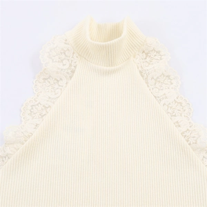 Elegant beige ribbed knit top featuring mock neck and delicate floral lace cuffs