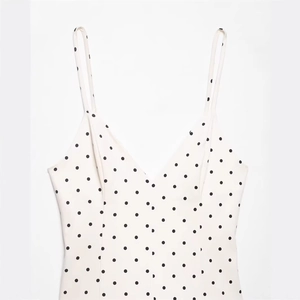 Elegant white polka dot V-neck slim fit sundress with thin adjustable shoulder straps