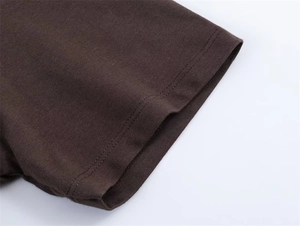 Close-up of dark brown ribbed knit cuff with durable double-needle stitching detail