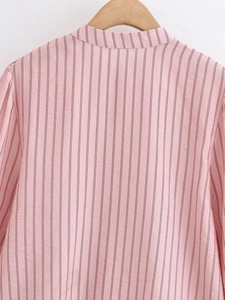 Back view of a pink and white striped women's blouse with a ruffle stand collar