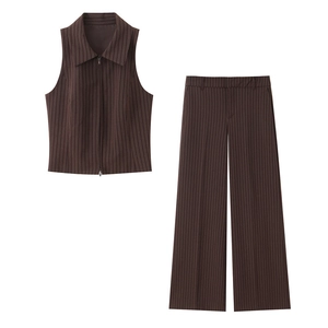 Detailed texture of brown pinstripe fabric on a sleeveless zipper vest and wide leg pants
