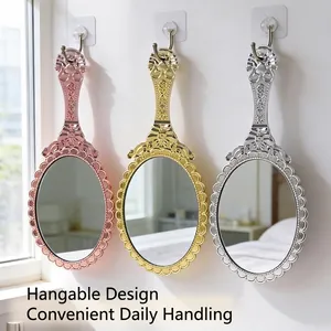 Vintage style electroplated handheld mirrors in gold and silver with hangable design