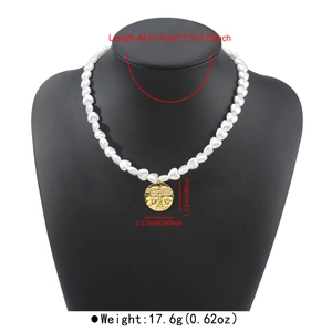 Vintage pearl necklace with gold abstract face pendant including size and weight details