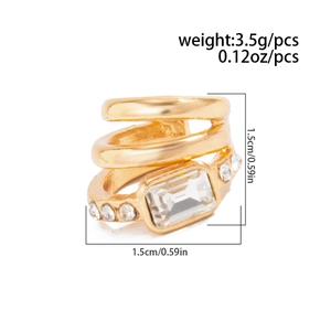 Macro view of gold multi-layer ear cuff with rectangular crystal and size dimensions