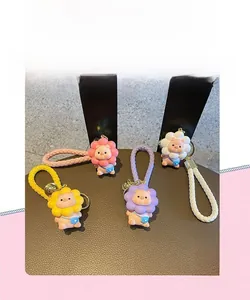 Detailed view of resin cartoon pig keychains in yellow, pink, purple, and white colors