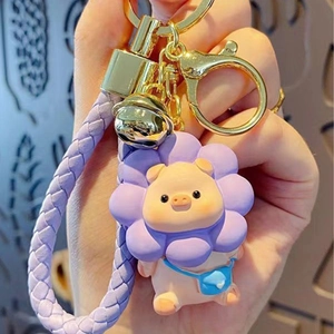 Cute pink pig keychain with purple sunflower hood and woven leather strap with bell