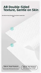 Detail of disposable towel with double-sided pearl and plain texture for facial cleaning