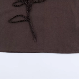 Deep brown cotton T-shirt featuring a unique pleated waist detail and bow tie design
