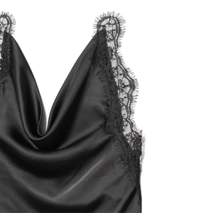 Detail of elegant black satin camisole featuring delicate eyelash lace trim and V-neckline