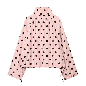 Back view of pink polka dot windbreaker jacket with high collar and drawstring hem
