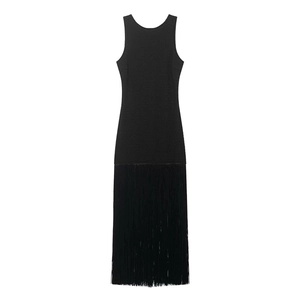 Detail shot of black sleeveless dress featuring dense fringe trim and a racerback design
