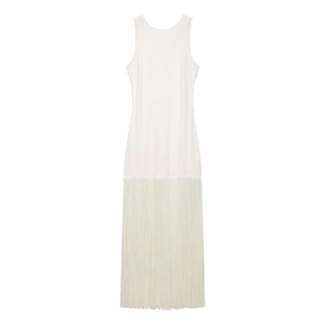 Detail of off-white sleeveless dress featuring layered long tassels and knit bodice