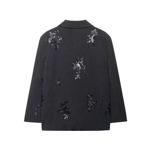Detailed back view of a pinstripe blazer with intricate floral sequin embroidery