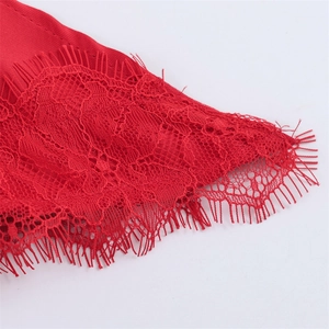 Close-up of vibrant red eyelash lace and satin texture on a sexy women top