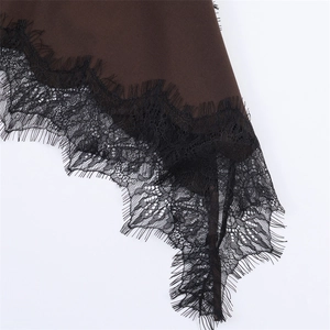 Detailed view of dark brown fabric with exquisite black eyelash lace trim detail