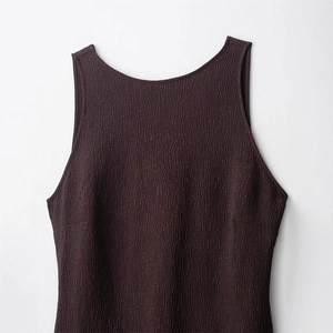 Minimalist deep purple sleeveless dress featuring a textured crinkle fabric and round neckline