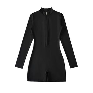 Close-up of sleek black long-sleeve bodysuit with front zipper and stand collar detail