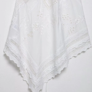 Elegant white floral lace blouse with scalloped edge and delicate embroidery detail