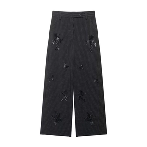 Elegant black high-waisted wide-leg trousers with white stripes and sequin butterfly motifs